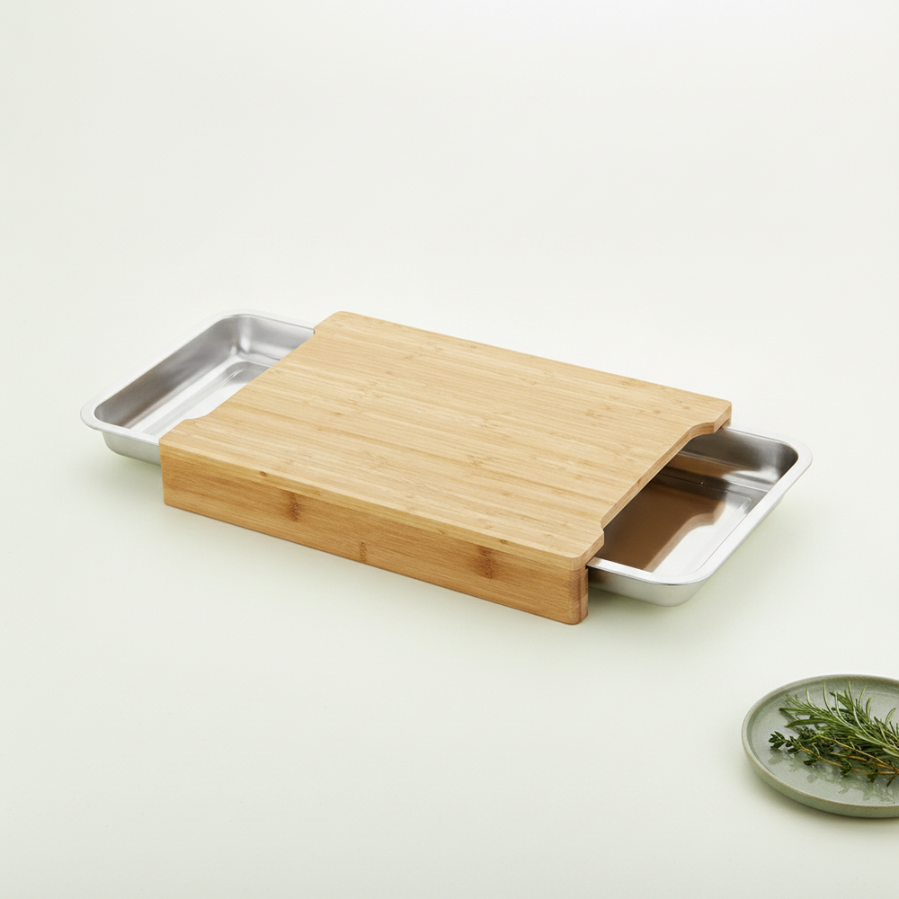 Cozozi Bamboo Cutting Board with its drawer slightly open, centered on a bright white to warm cream gradient background.